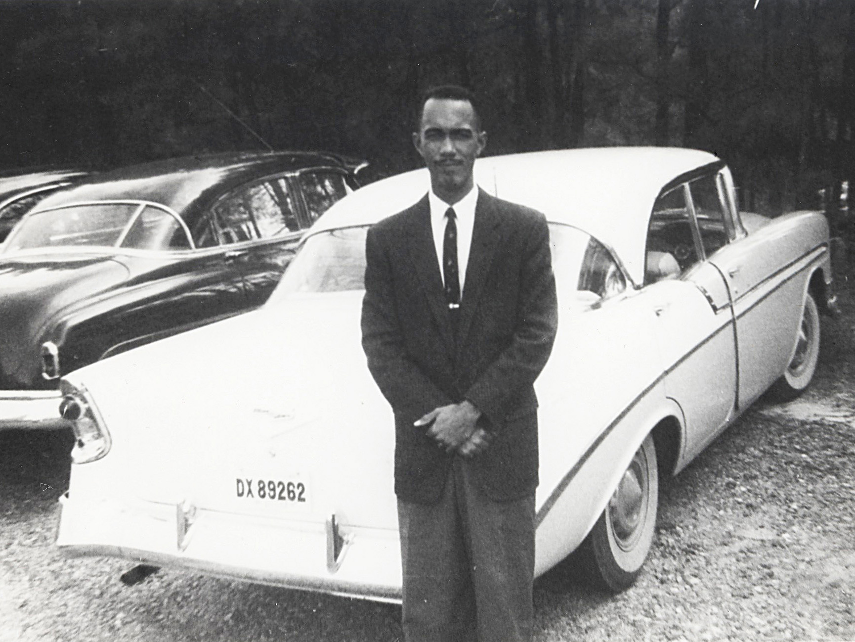Ervin Perry in front of car