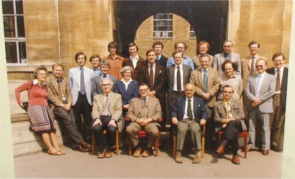 an aged photo of John Goodenough with a crowd posing outside Oxford university