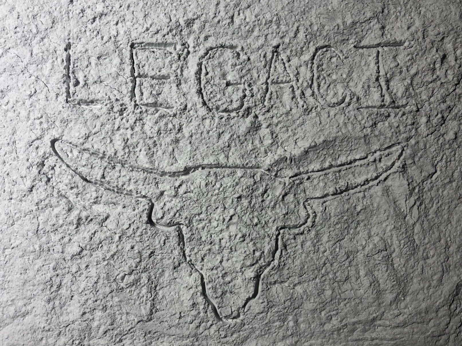 LEGACI text with UT longhorn outline written on the moon's surface